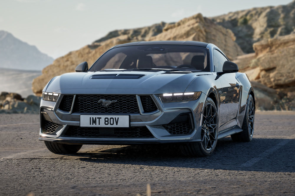A Ford Mustang GT Fastback Nite Pony Coupe in Carbonised Grey paint parked on a mountain road.