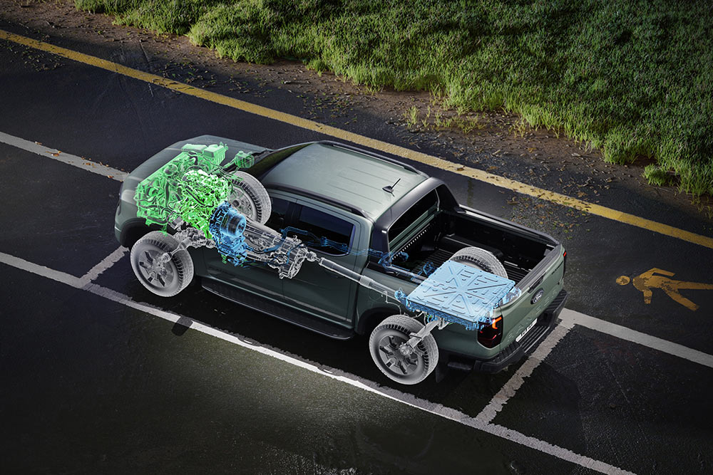 Ford Ranger parked next to field of grass, with an interior view highlighting its interior mechanics.