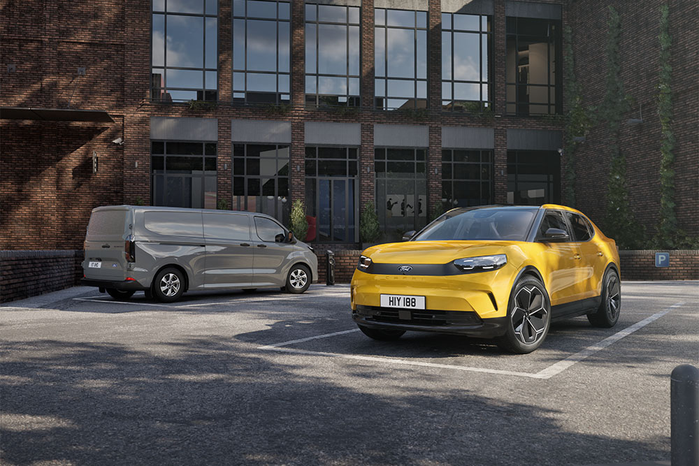 Two Ford fleet vehicles: a grey Ford Transit Custom van and a yellow Ford Capri